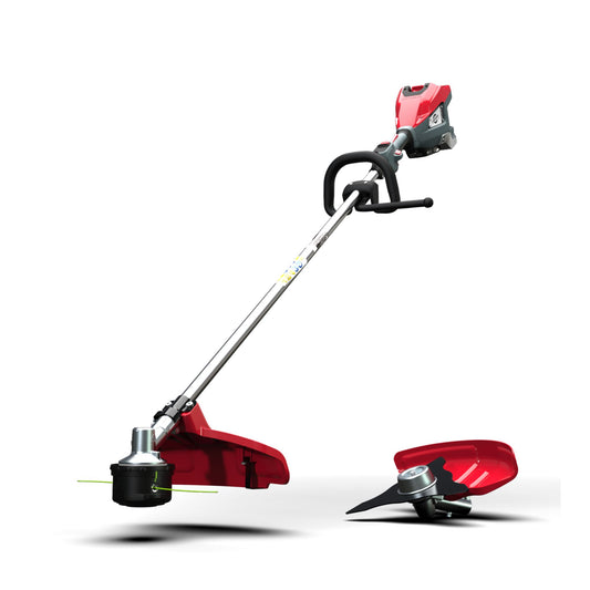 Red and black grass trimmer on a white background