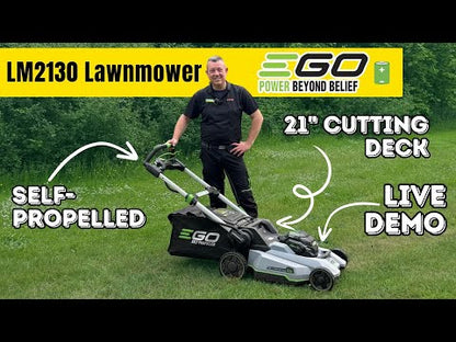 Man standing behind a grey and black lawnmower