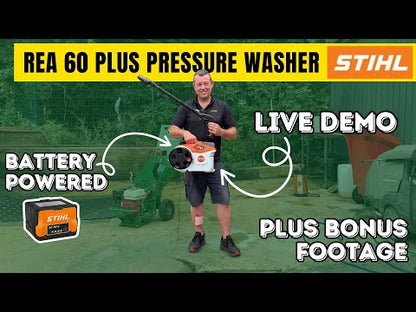 Man holding orange and white mini pressure washer with lance pointing in the air
