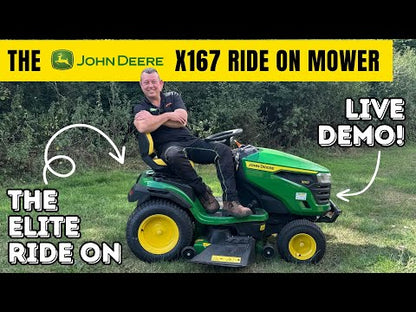 Man sitting on green and yellow Joh  Deere lawn tractor
