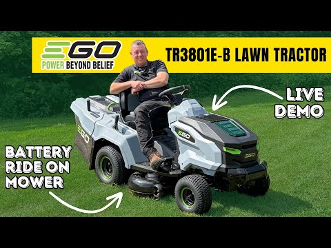 Man on grey and black lawn tractor about to cut grass